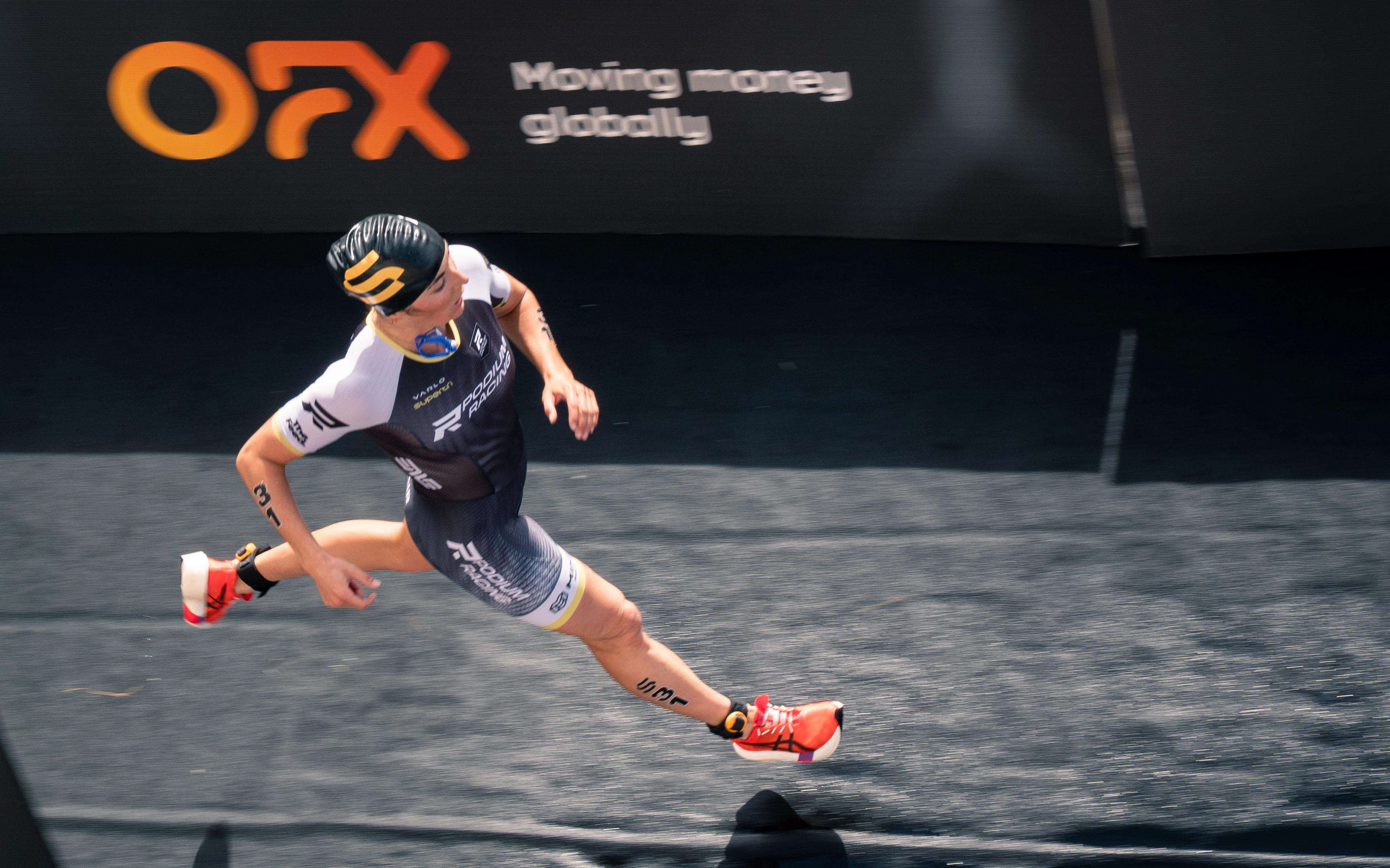 Supertri athlete sprinting